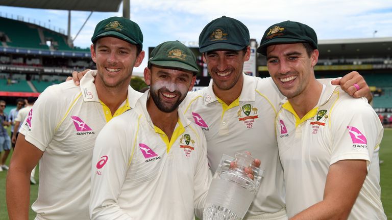 Australia's bowling attack of Josh Hazlewood (L), Nathan Lyon (2/L), Mitchell Starc (2/R) and Pat Cummins (R) celebrate after defeating England and retaini