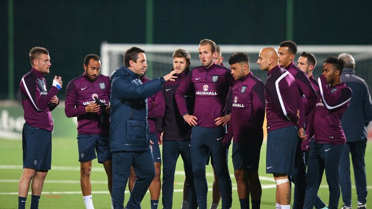 VILNIUS, LITHUANIA - OCTOBER 11:  Harry Kane and Jonjo Shelvey of England stand alongside team mates as they listen to Gary Neville during a training sessi