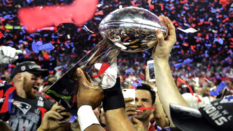 New England Patriots celebrate with the Vince Lombardi Trophy after defeating the Atlanta Falcons at Super Bowl 51 on February 5, 2017