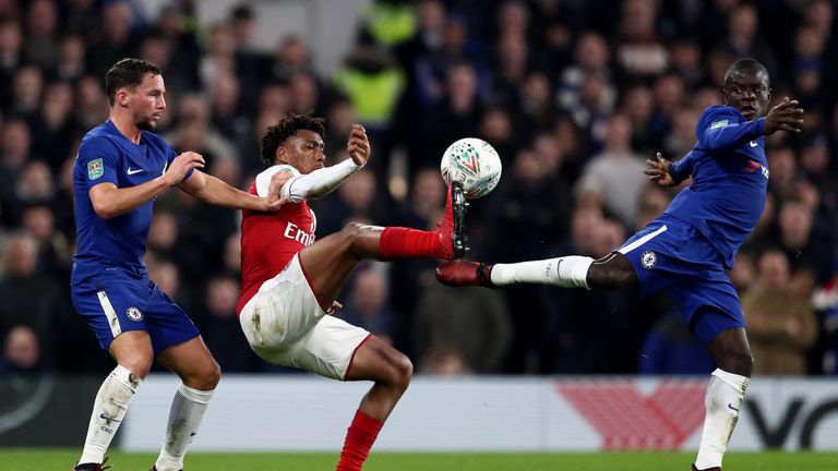 N'Golo Kante and Danny Drinkwater of Chelsea tackles Alex Iwobi of Arsenal during the Carabao Cup Semi-Final First Leg match