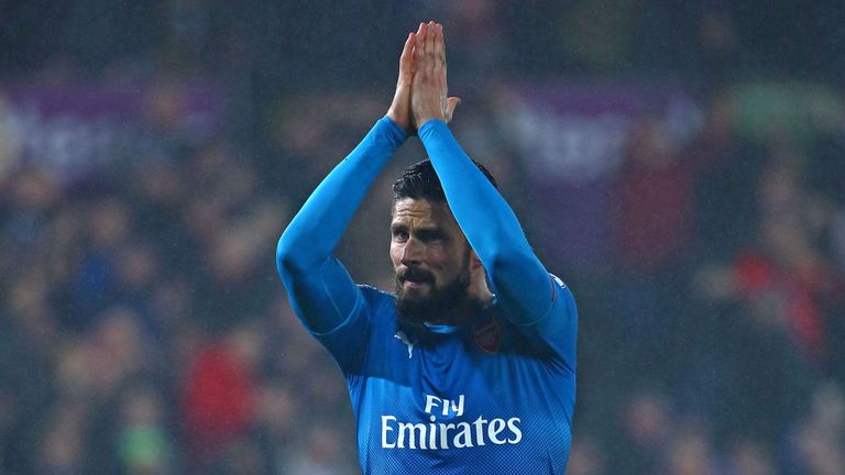 Arsenal's French striker Olivier Giroud applauds supporters on the pitch after the English Premier League football match between Swansea City and Arsenal a