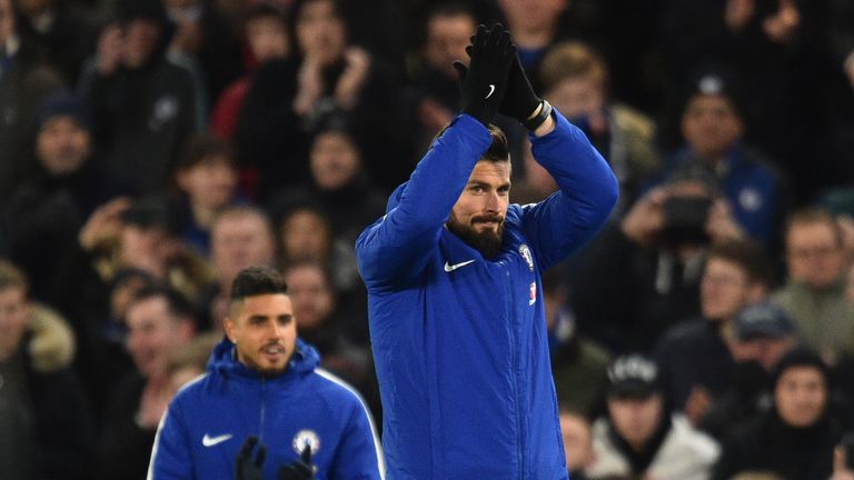 Olivier Giroud applauds the Chelsea fans after being unveiled at Stamford Bridge on Wednesday