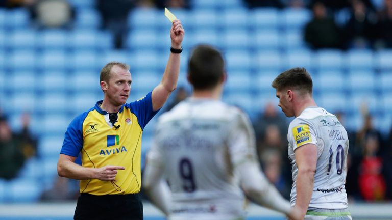 COVENTRY, ENGLAND - JANUARY 07: Owen Farrell of Saracens is shown a yellow card by referee Wayne Barnes during the Aviva Premiership match between Wasps an