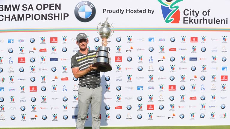 JOHANNESBURG, SOUTH AFRICA - JANUARY 14:  Chris Paisley of England poses with the trophy after his victory during day four of the BMW South African Open Ch