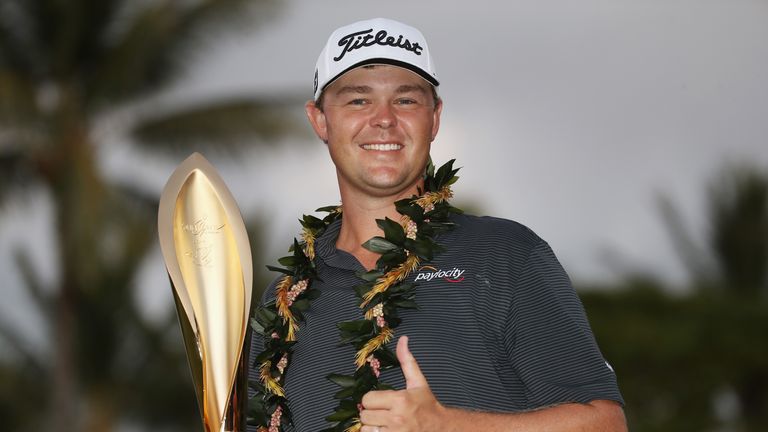 Patton Kizzire poses with the trophy after winning the Sony Open In Hawaii