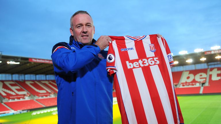Paul Lambert poses for the media as he is officially unveiled as the new Stoke City manager at the Britannia Stadium