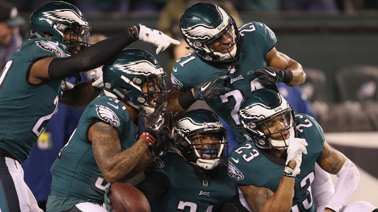 PHILADELPHIA, PA - JANUARY 21:  Corey Graham #24 of the Philadelphia Eagles is congratulated by his teammates after getting an interception during the four