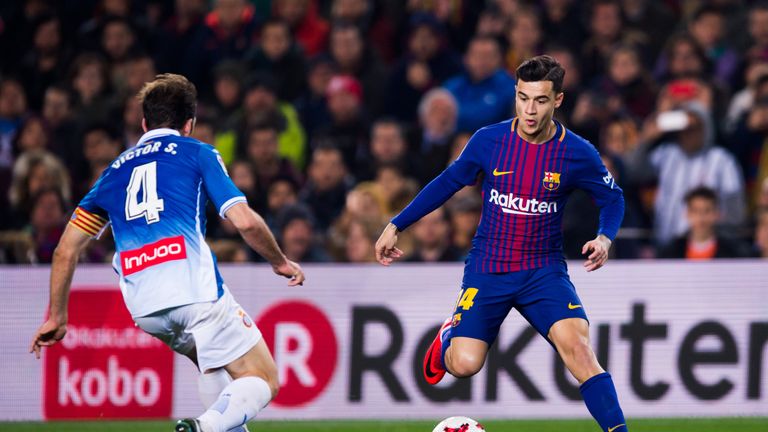 BARCELONA, SPAIN - JANUARY 25:  Philippe Coutinho of FC Barcelona dribbles Victor Sanchez of RCD Espanyol during the Spanish Copa del Rey Quarter Final Sec