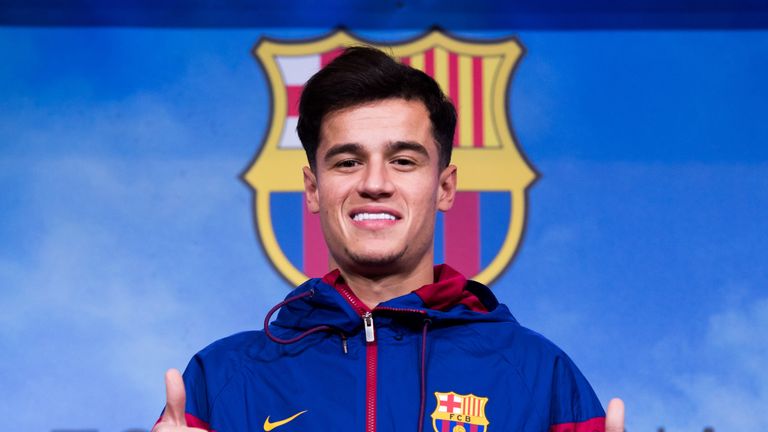 Philippe Coutinho poses prior to signing his new contract with Barcelona at Nou Camp Stadium on January 7, 2018