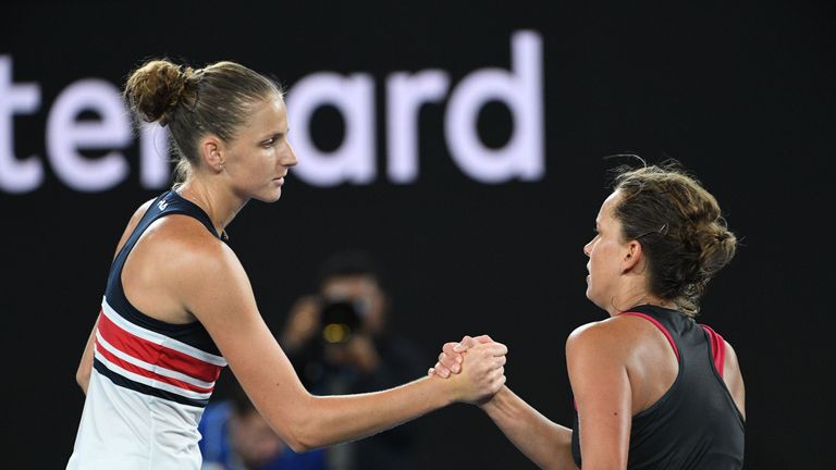 Czech Republic's Karolina Pliskova (L) shakes hands after victory in her women's singles fourth round match against Czech Republic's Barbora Strycova on da