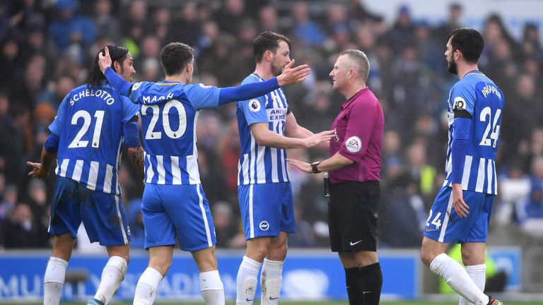 Brighton players appeal to referee Jon Moss after being denied a penalty during the Premier League match between Brighton and Chelsea