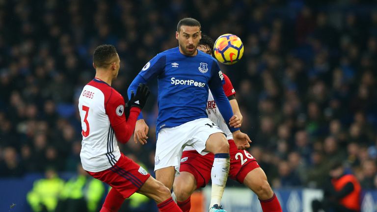 Cenk Tosun keeps his eye on the ball while under pressure from Kieran Gibbs