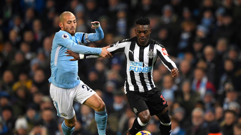 David Silva and Christian Atsu in action during the Premier League match between Manchester City and Newcastle United