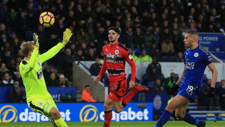 Islam Slimani scores Leicester's second goal with a chip over Jonas Lossl