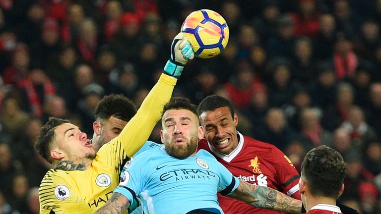 Ederson comes out to punch the ball clear during the Premier League football match between Liverpool and Manchester City
