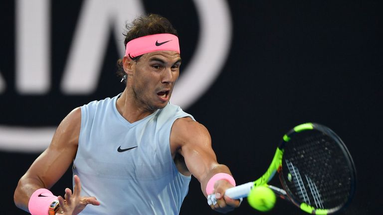 Spain's Rafael Nadal hits a return against Dominican Republic's Victor Estrella Burgos during their men's singles first round match on day one of the Austr