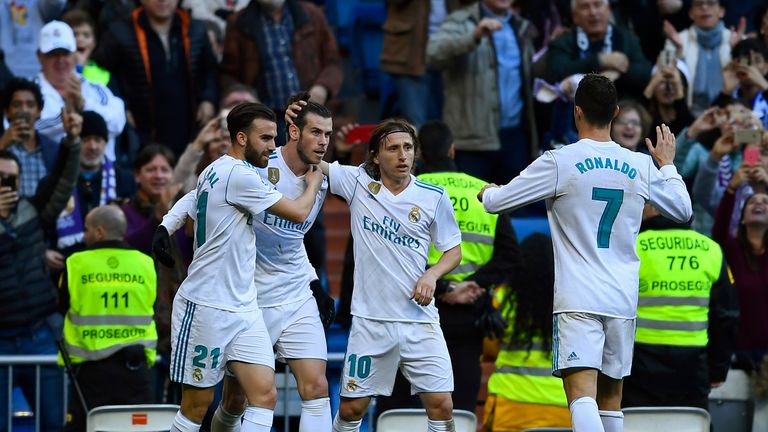 Real Madrid team-mates celebrate with Gareth Bale after his first goal