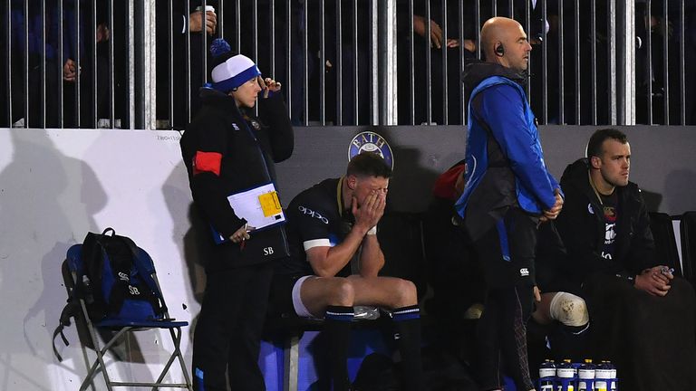 BATH, ENGLAND - JANUARY 12:  Rhys Priestland of Bath sits dejected on the bench after going off injured during the European Rugby Champions Cup match betwe
