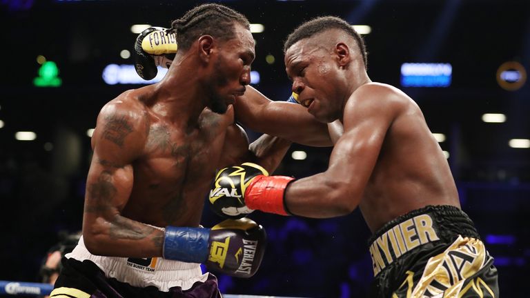  Robert Easter Jr. (left) and Javier Fortuna exchange punches  during their IBF lightweight title bout