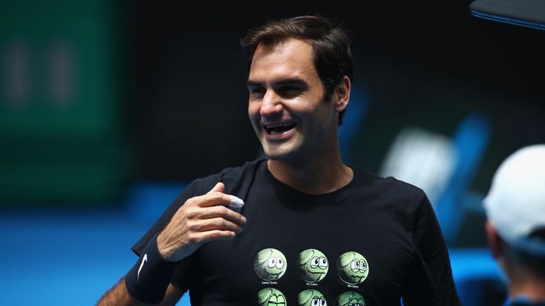 Roger Federer of Switzerland in good spirits during a practice session ahead of the 2018 Australian Open at Melbourne Park