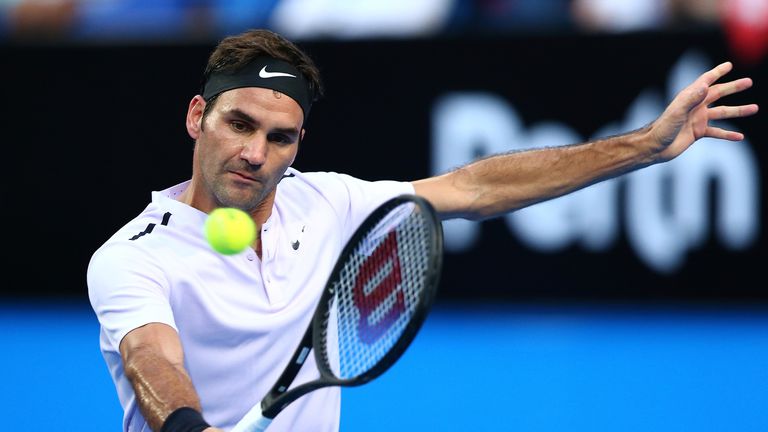 Roger Federer of Switzerland plays a backhand to Karen Khachanov of Russia in the mens singles match on Day Four