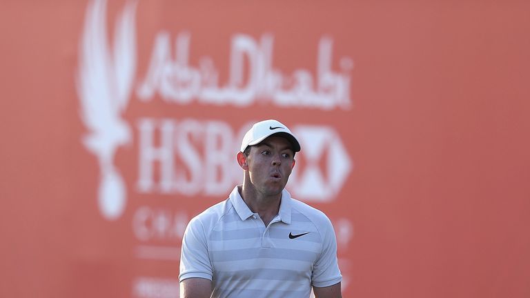ABU DHABI, UNITED ARAB EMIRATES - JANUARY 15:  Rory McIlroy of Northern Ireland looks on on the 18th green during a practice round ahead of Abu Dhabi HSBC 