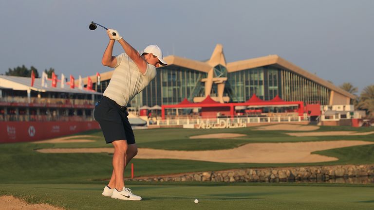 ABU DHABI, UNITED ARAB EMIRATES - JANUARY 15:  Rory McIlroy of Northern Ireland plays his second shot from the 18th fairway during a practice round ahead o