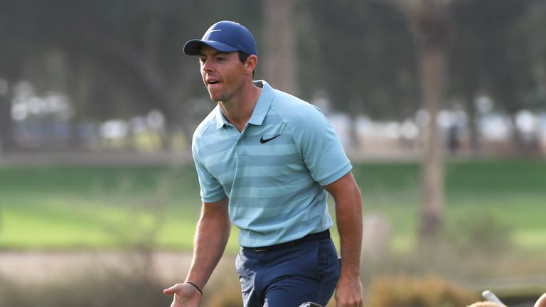 DUBAI, UNITED ARAB EMIRATES - JANUARY 28:  Rory McIlroy of Northern Ireland reacts after he plays his second shot on the 17th hole during the final round o