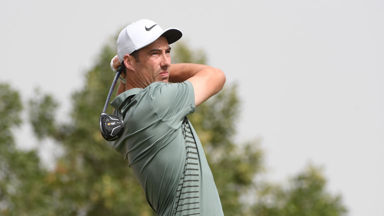 Ross Fisher of England plays his shot from the third tee during the final round of the Abu Dhabi HSBC Golf Championship