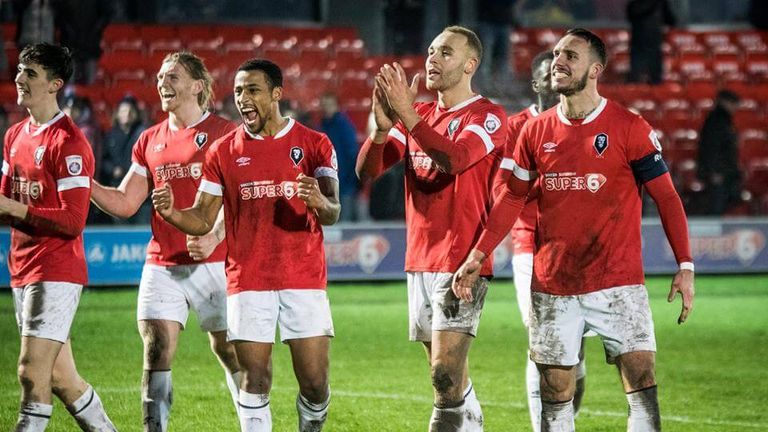 Salford City celebrate their 2-1 victory over Harrogate Town