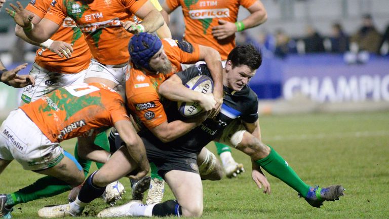 Bath flanker Sam Underhill is swamped by the Benetton defence