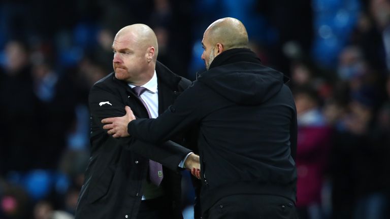 MANCHESTER, ENGLAND - JANUARY 06:  Sean Dyche, Manager of Burnley shakes hands with Josep Guardiola, Manager of Manchester City after the The Emirates FA C