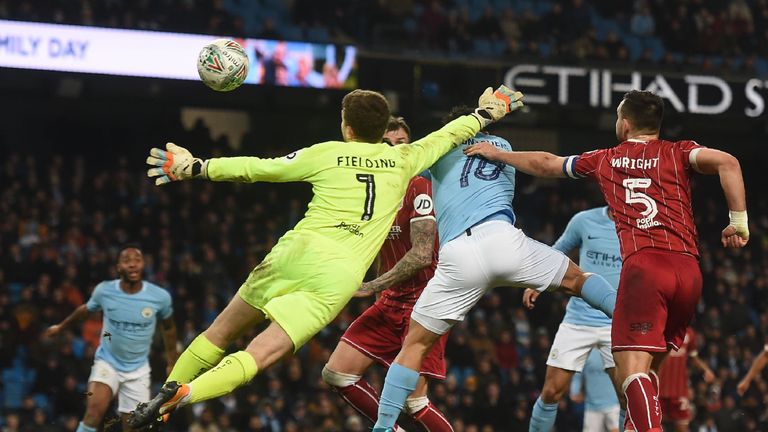 Sergio Aguero heads a late winner during the League Cup semi-final first leg between Manchester City and Bristol City