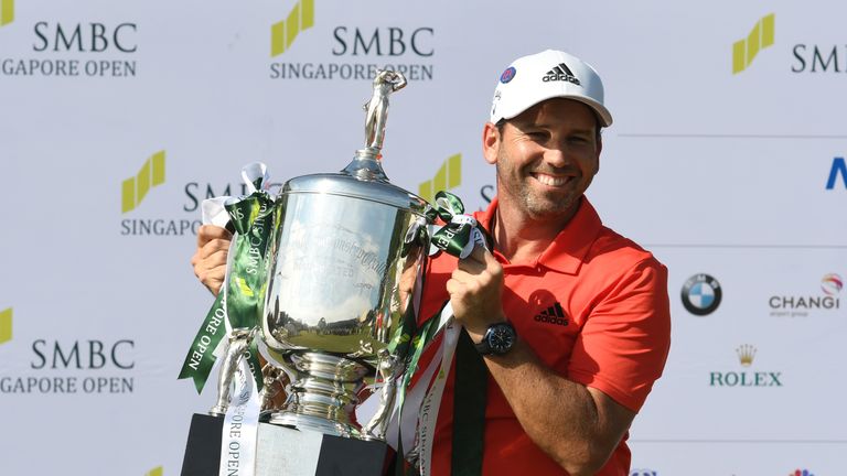 Sergio Garcia of Spain holds up the winner's trophy after his victory in the Singapore Open