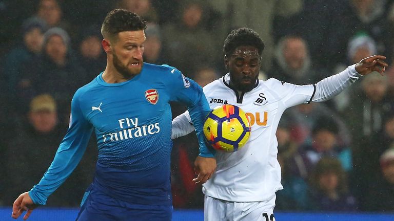 Shkodran Mustafi and Nathan Dyer in action during the at The Liberty Stadium