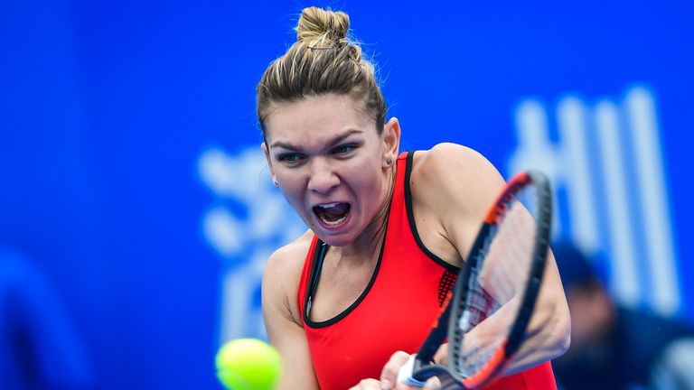 Simona Halep of Romania hits a return against Nicole Gibbs of the US in the first round of the Shenzhen Open tennis tournament