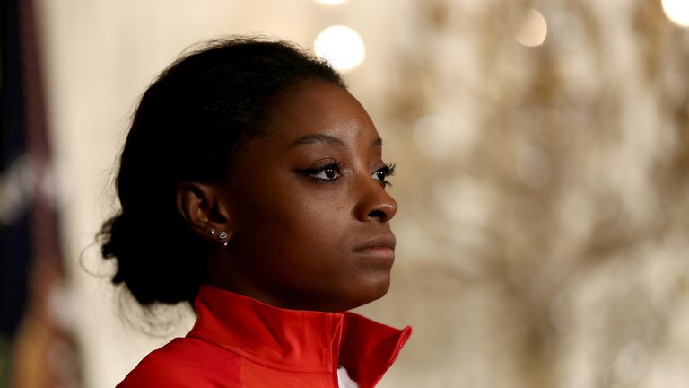 WASHINGTON, DC - SEPTEMBER 29:  Olympic medalist Simone Biles stands on stage during an East Room event at the White House September 29, 2016 in Washington