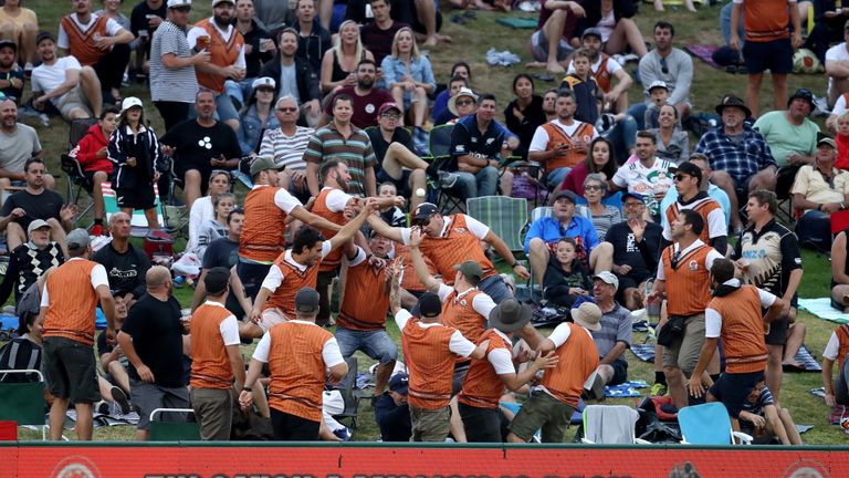 Fans attempt to catch a six as part of the Tui Catch A Million promotion during game three of the Twenty20 series between New Zealand and the West Indies.