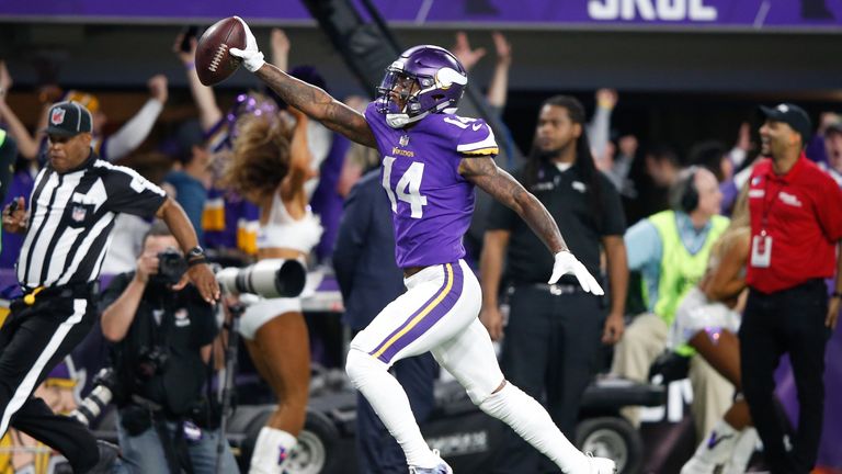 MINNEAPOLIS, MN - JANUARY 14:  Stefon Diggs #14 of the Minnesota Vikings scores a touchdown as time expires against the New Orleans Saints during the secon