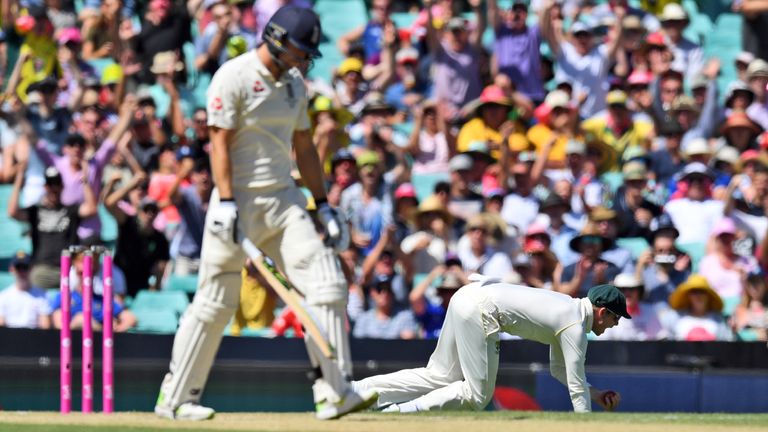 Australia's captain Steve Smith (R) celebrates after taking a catch to dismiss England batsman David Malan (L) on the second day of the fifth Ashes cricket