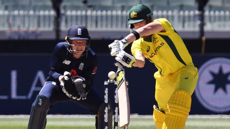 Australia's Steve Smith (L) snicks a catch to England wicketkeeper Jos Buttler (L) during their one-day international cricket match played at the MCG in Me