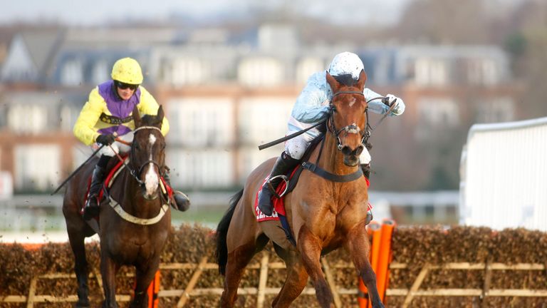 Summerville Boy and Noel Fehily pull away from the last flight to go on and win The 32Red Tolworth Novices' Hurdle Race run during 32Red Day at Sandown Par