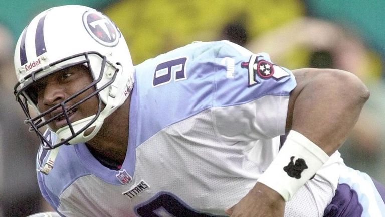 JACKSONVILLE, :  Tennessee Titans' quarterback Steve McNair is caught by Seth Payne of the Jacksonville Jaguars after running for eight yards in second qua