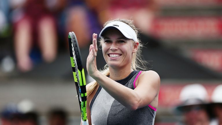 Caroline Wozniacki of Denmark acknowledges the fans after winning her match against Petra Martic of Croatia