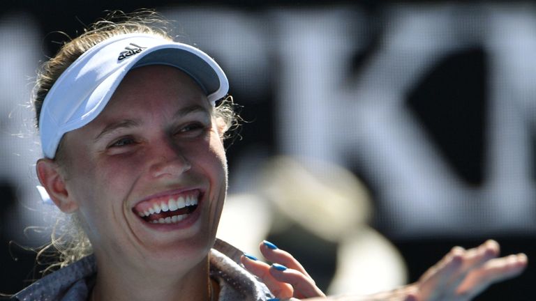 Denmark's Caroline Wozniacki smiles as she is interviewed after beating Belgium's Elise Mertens in their women's singles semi-finals