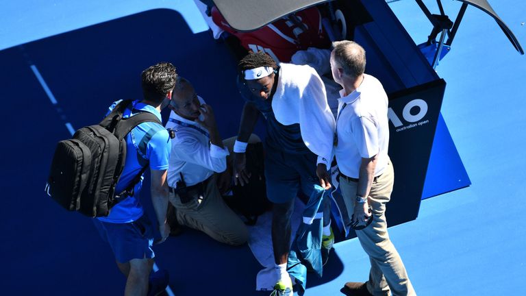 France's Gael Monfils talks during their men's singles second round match against Serbia's Novak Djokovic on day four of the Australian Open