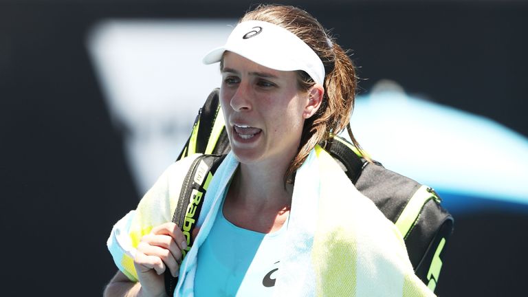 A disappointed Johanna Konta of Great Britain walks off the court after losing her second round match against Bernarda Pera