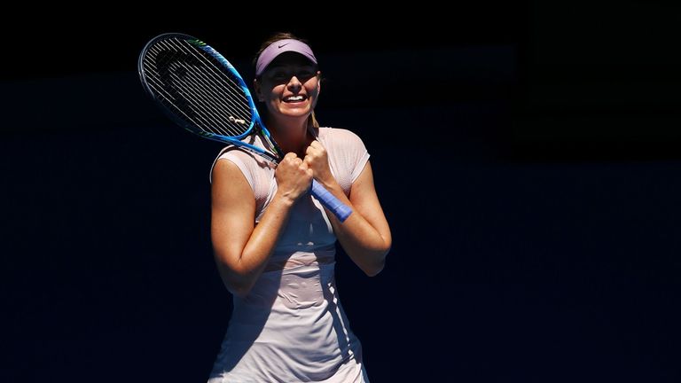 Maria Sharapova of Russia celebrates winning match point in her second round match against Anastasija Sevastova