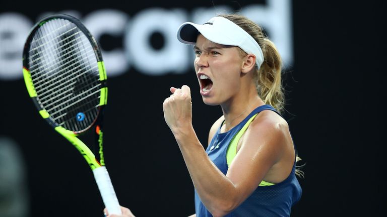 Caroline Wozniacki of Denmark celebrates winning a point in her women's singles final against Simona Halep