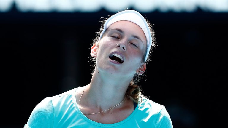 Elise Mertens of Belgium reacts in her semi-final match against Caroline Wozniacki of Denmark